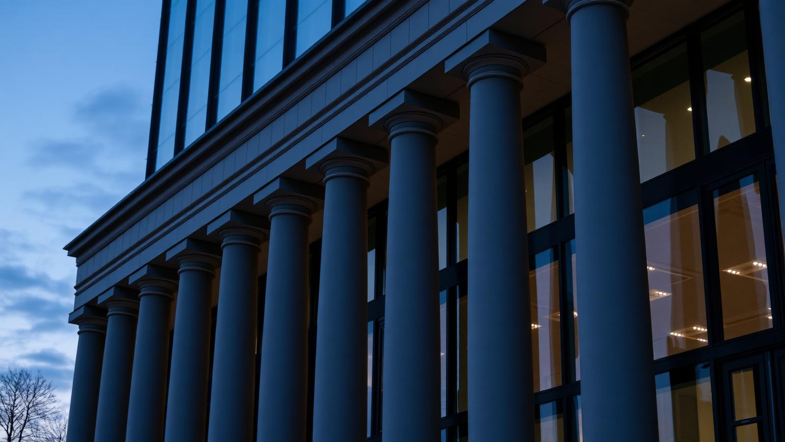Columned regulatory authority building at dusk